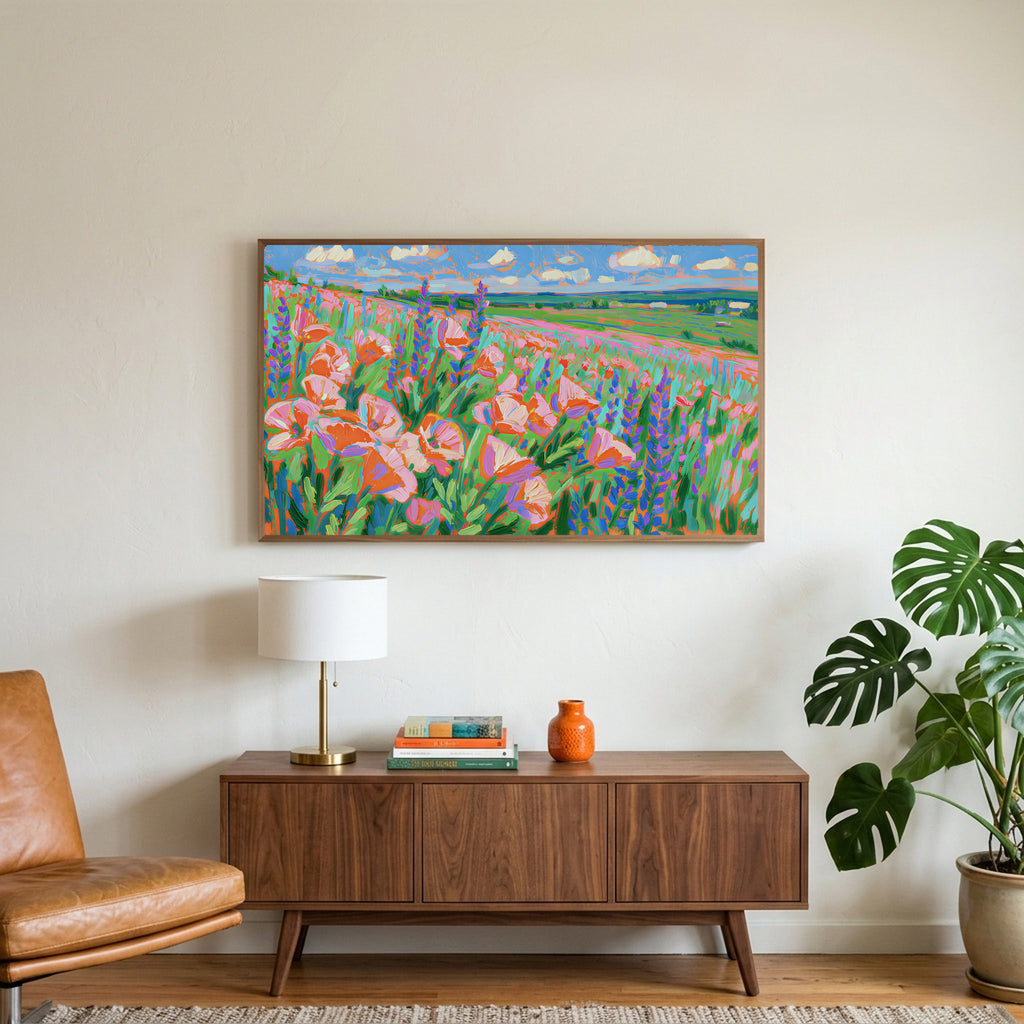 Poppy field art on a TV above a walnut credenza with a brass lamp and a monstera plant