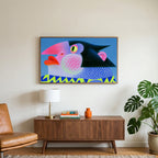 Pop art penguin art on a TV above a walnut credenza with a brass lamp and a monstera plant