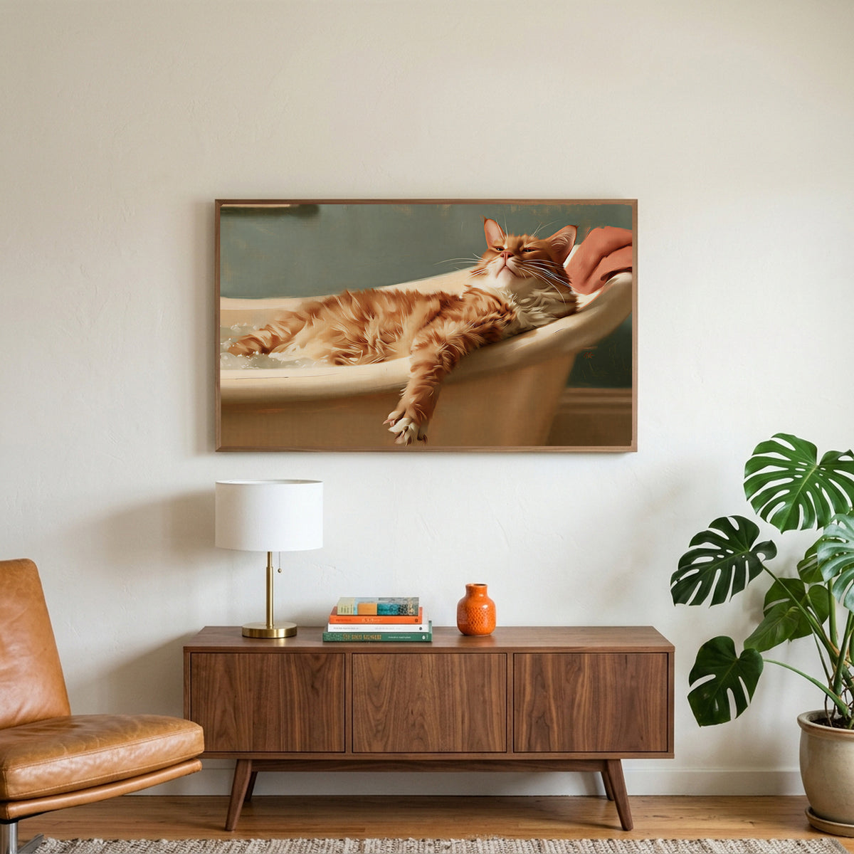 Cat in a bathtub art on a TV above a walnut credenza with a brass lamp and a monstera plant