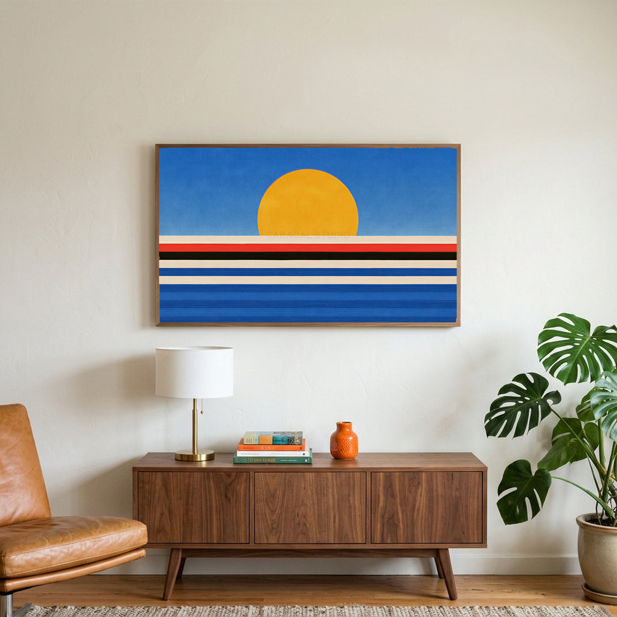 Retro sunset over the sea art on a TV above a walnut credenza with a brass lamp and a monstera plant