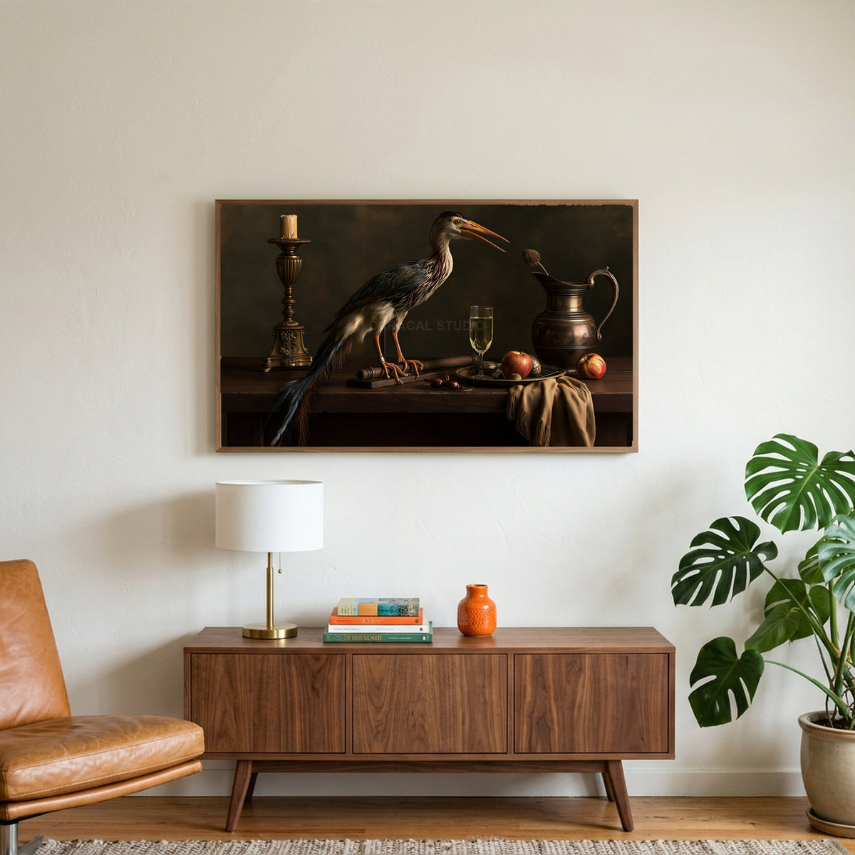 Heron still life art on a TV above a walnut credenza with a brass lamp and a monstera plant