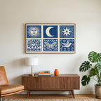 Celestial folk art on a TV above a walnut credenza with a brass lamp and a monstera plant