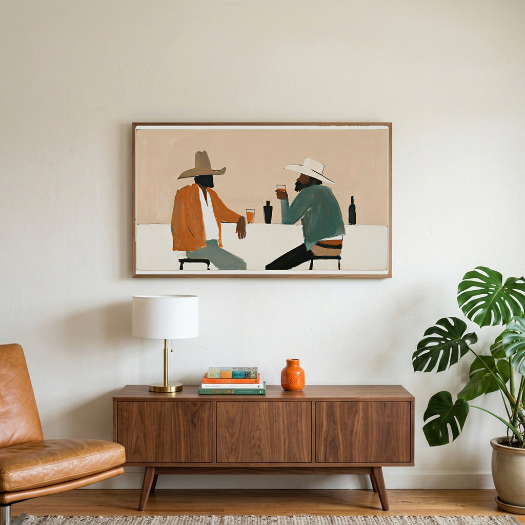 Cowboys and saloon drinks art on a TV above a walnut credenza with a brass lamp and a monstera plant