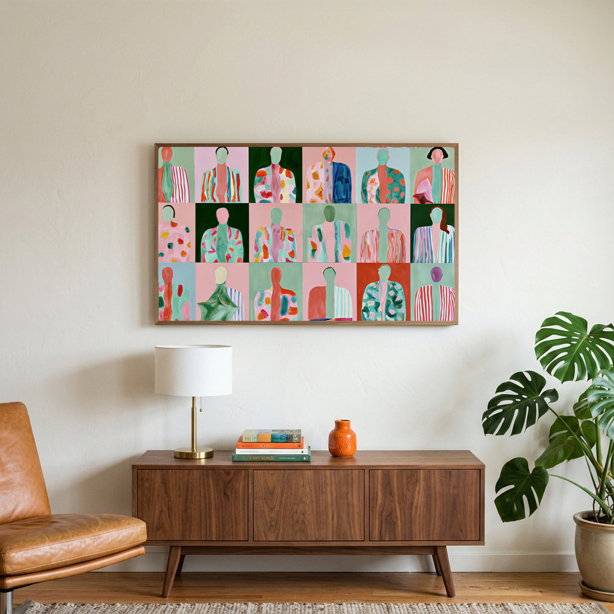 Faceless portraits art on a TV above a walnut credenza with a brass lamp and a monstera plant