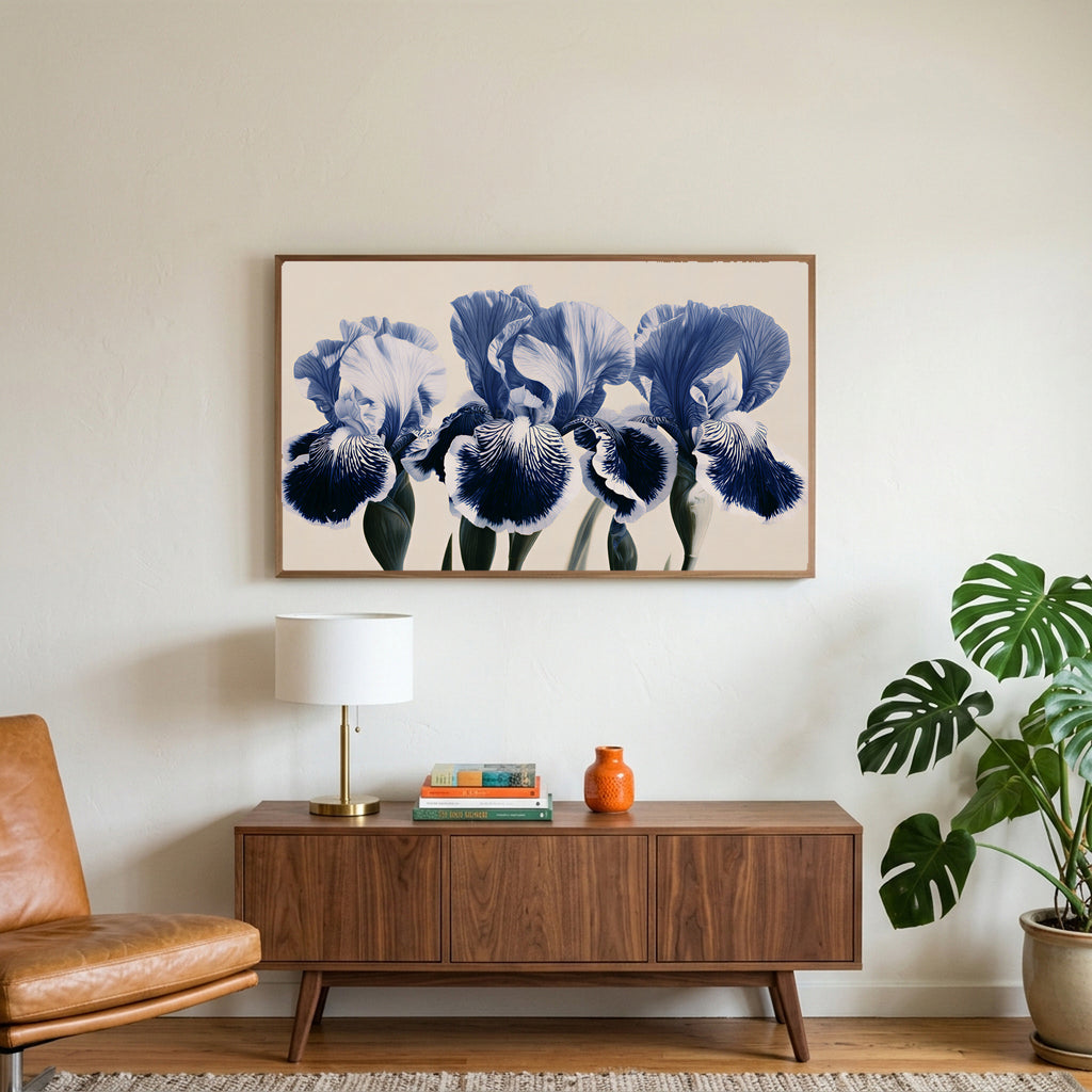 Blue iris art on a TV above a walnut credenza with a brass lamp and a monstera plant
