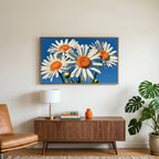 Daisy art on a TV above a walnut credenza with a brass lamp and a monstera plant
