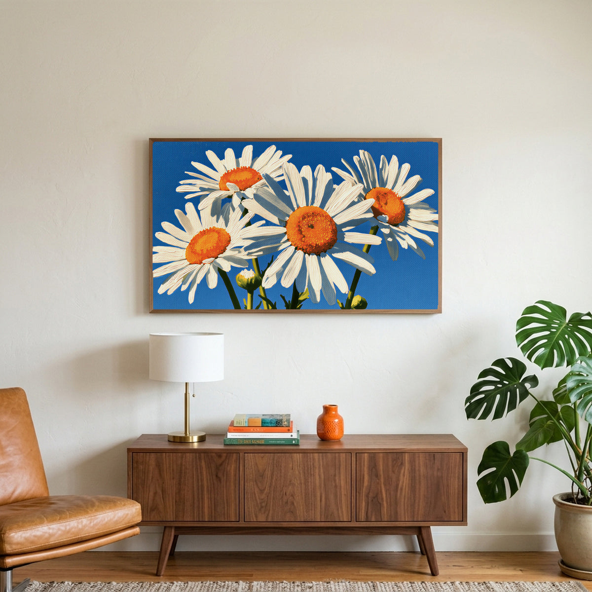Daisy art on a TV above a walnut credenza with a brass lamp and a monstera plant