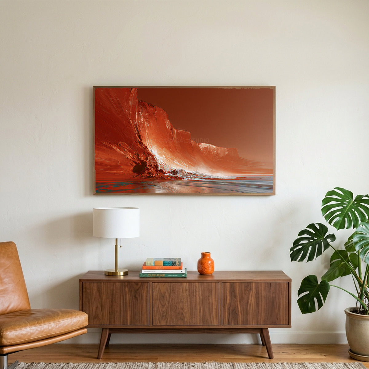 Red sea cliffs art on a TV above a walnut credenza with a brass lamp and a monstera plant