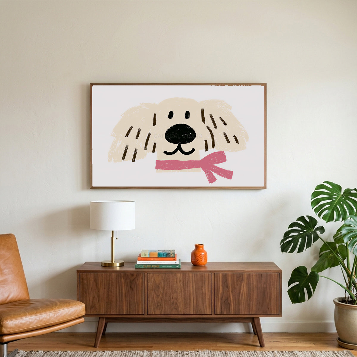 Puppy with a pink scarf art on a TV above a walnut credenza with a brass lamp and a monstera plant
