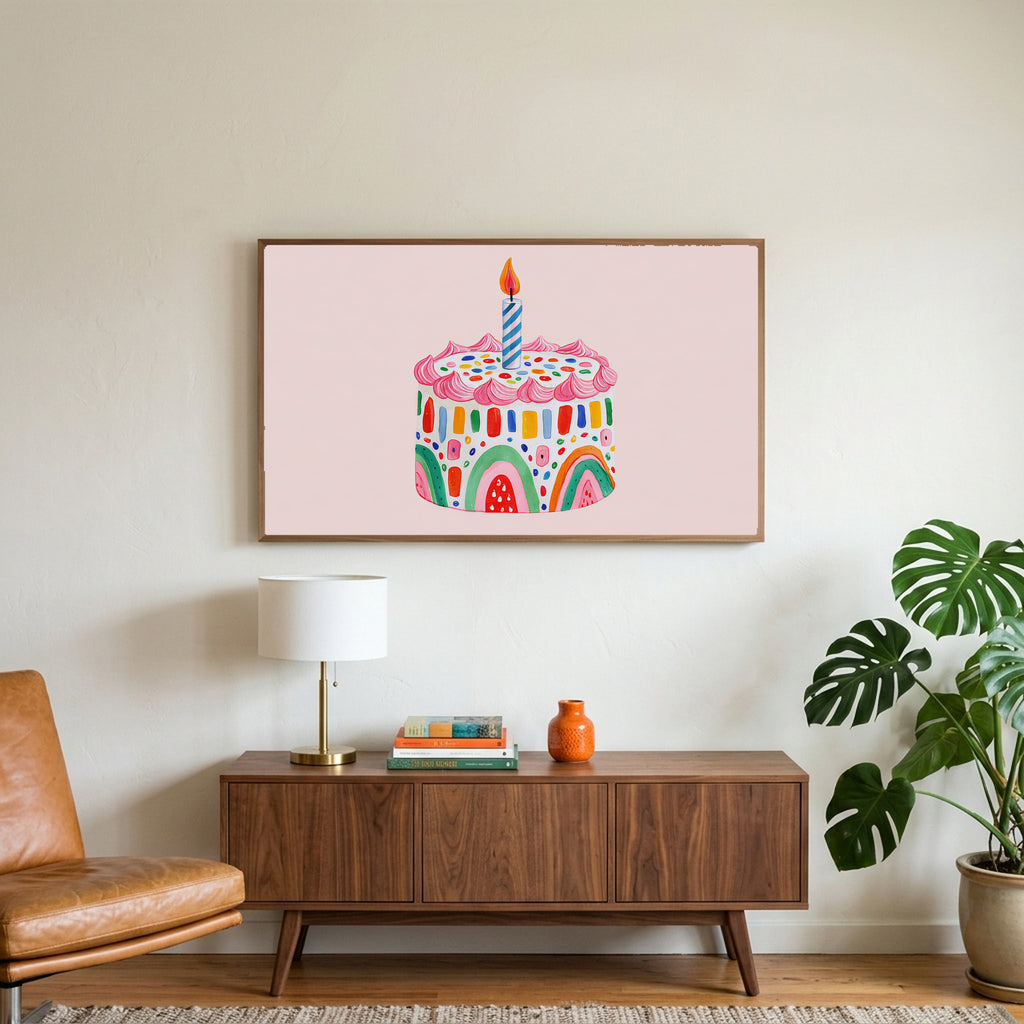 Rainbow birthday cake art on a TV above a walnut credenza with a brass lamp and a monstera plant