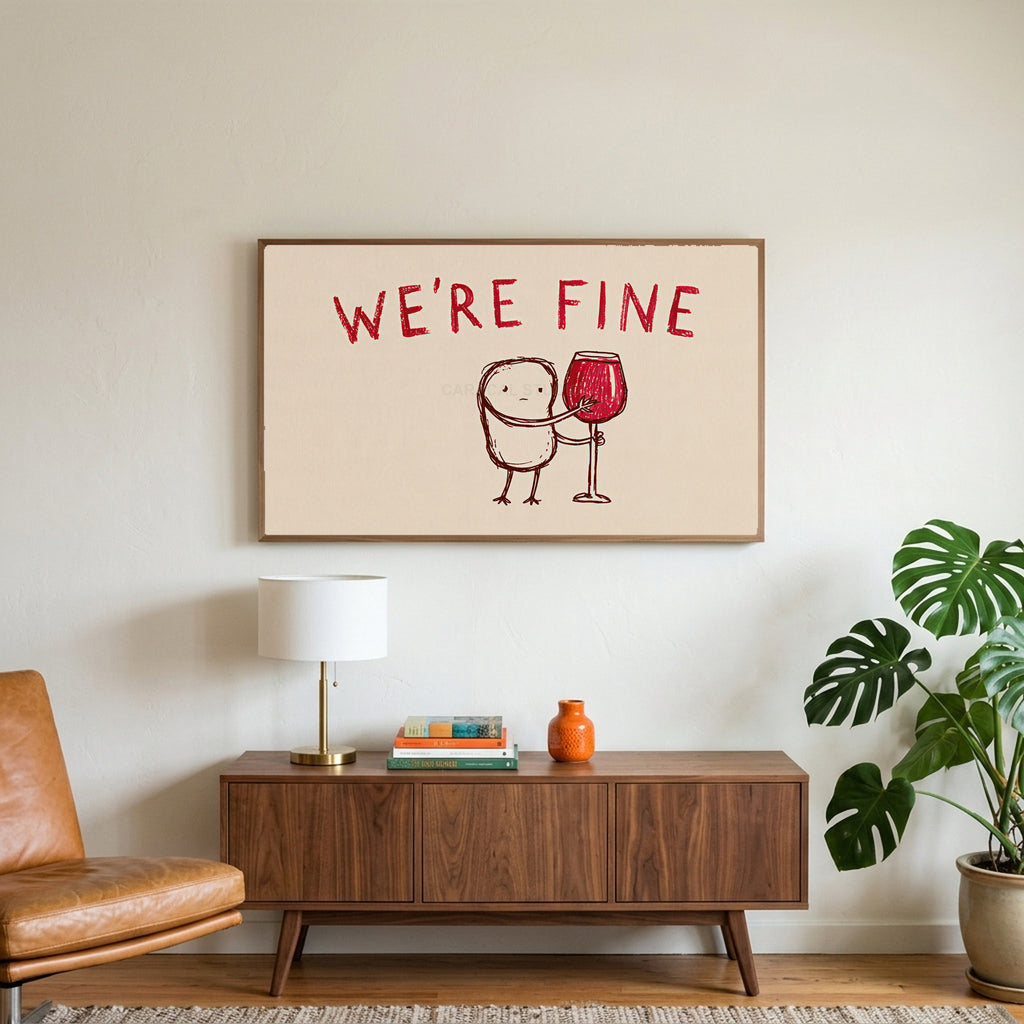 We're Fine wine doodle art on a TV above a walnut credenza with a brass lamp and a monstera plant