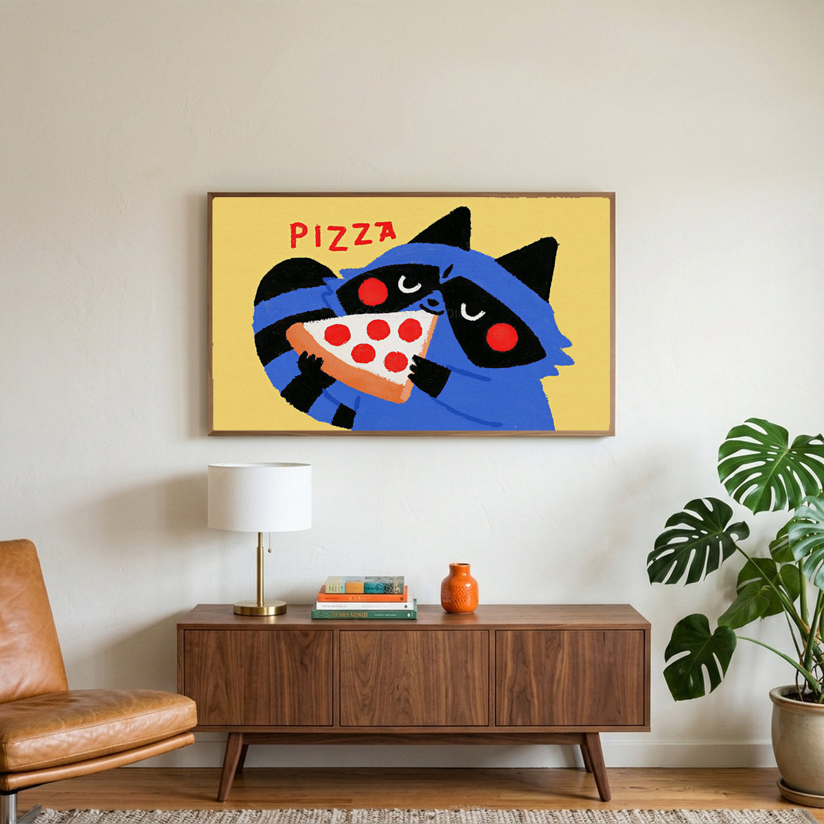 Raccoon pizza art on a TV above a walnut credenza with a brass lamp and a monstera plant
