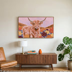 Highland cow in fall leaves art on a TV above a walnut credenza with a brass lamp and a monstera plant