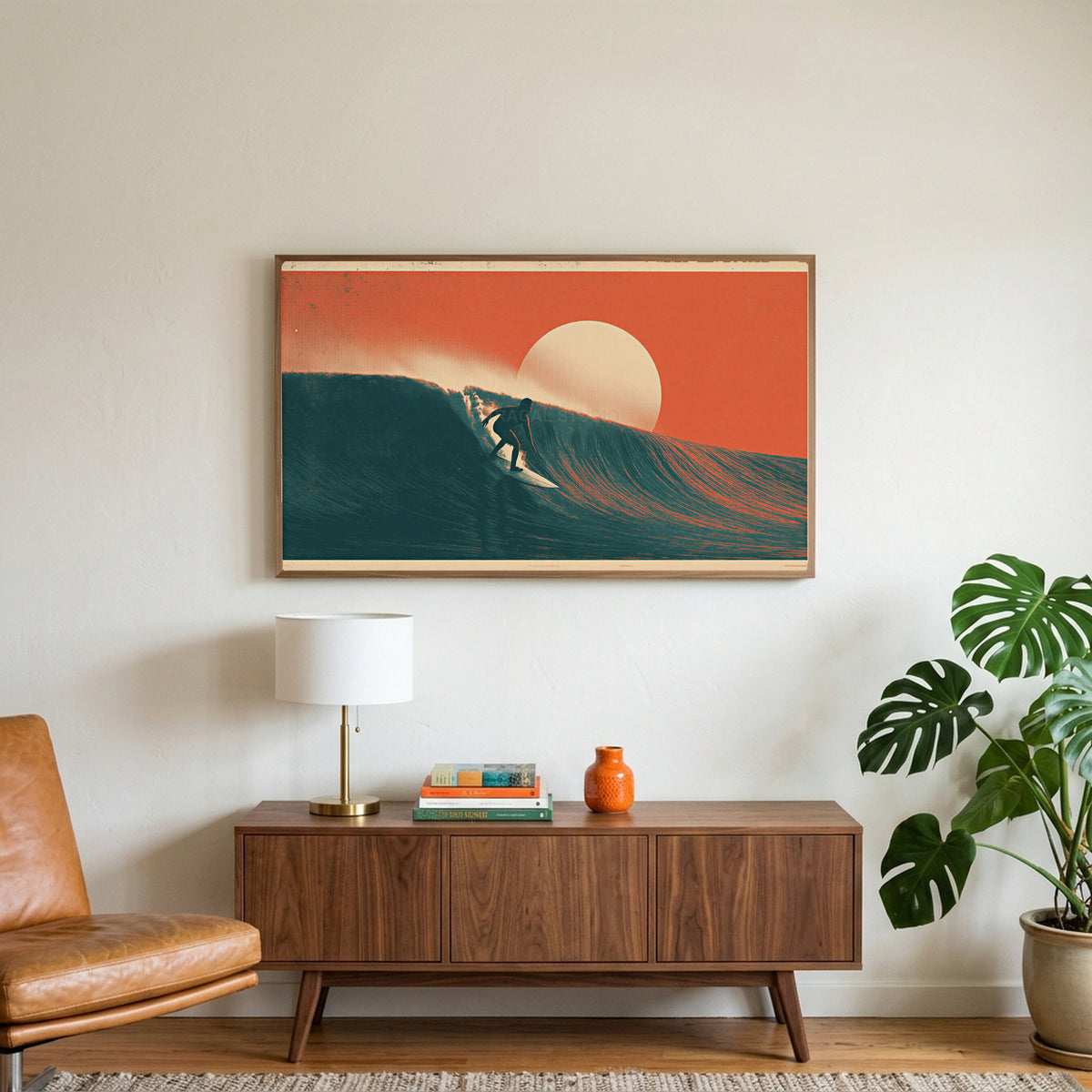 Surfer on a wave art on a TV above a walnut credenza with a brass lamp and a monstera plant