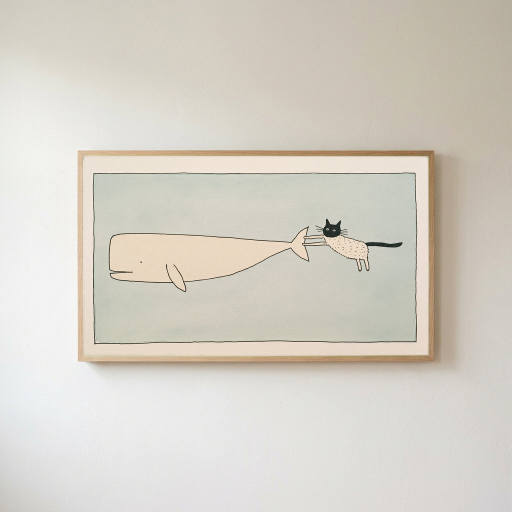 Frame TV art of a cat riding a flying whale in a light wood frame on a warm white wall