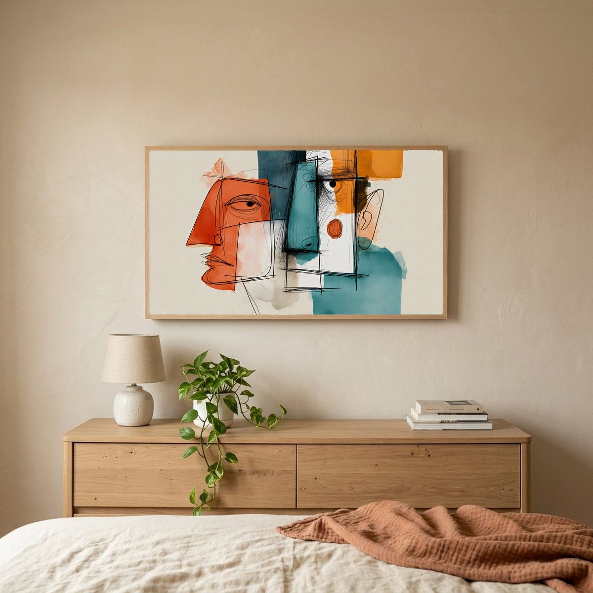 Cubist faces TV art above an oak dresser with a trailing plant in a calm bedroom