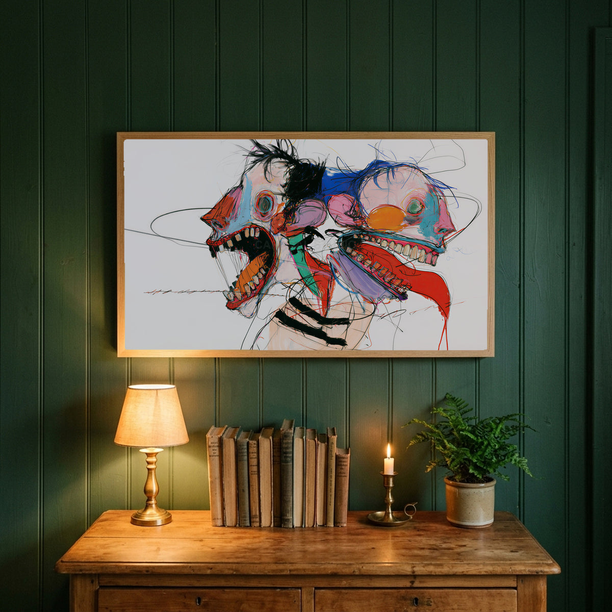 Expressive faces art on a forest green wall above a wooden dresser with a brass lamp