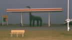 Foggy Gas Station Dinosaur artwork