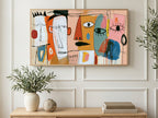 Naive Faces with Drips art on a TV in a living room
