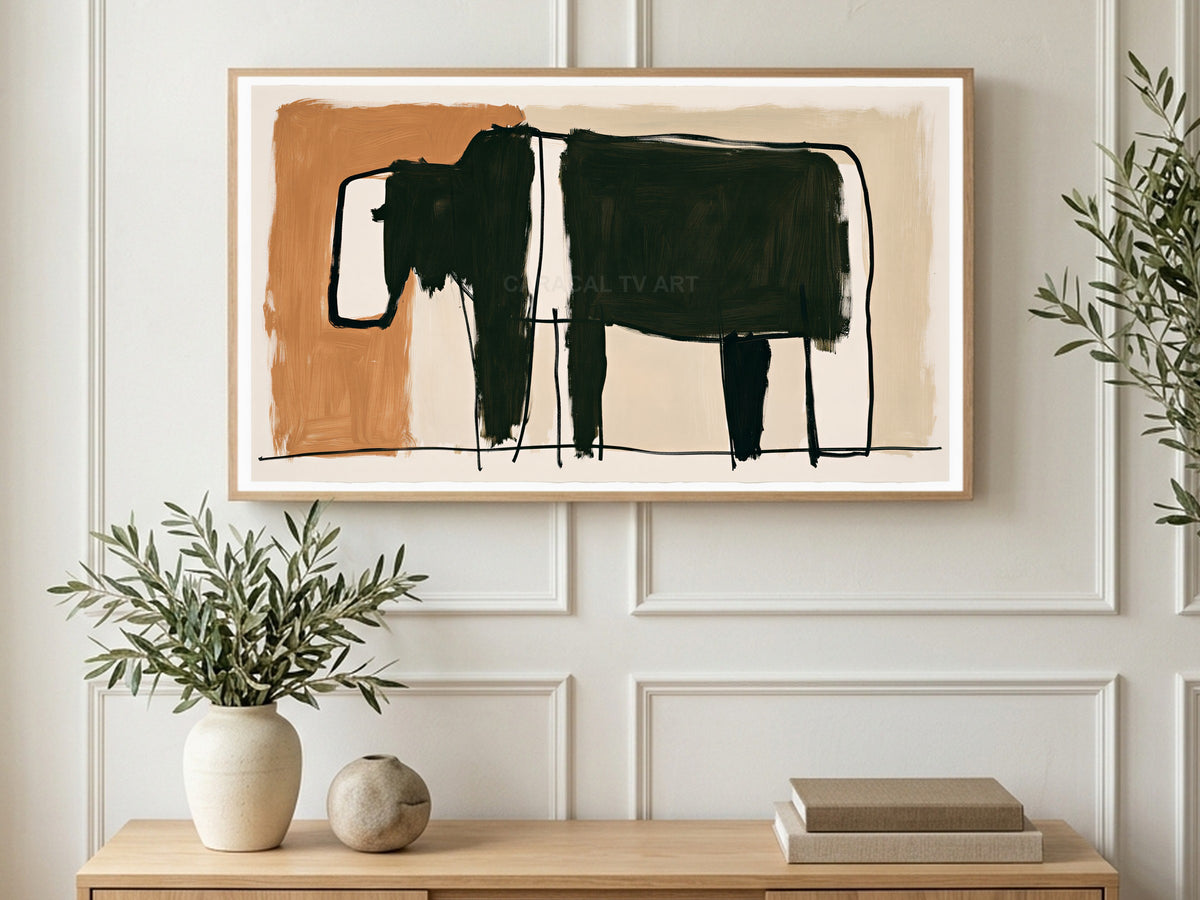 Black Belted Cow art on a TV in a living room
