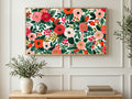 Painted Roses and Berries art on a TV in a living room