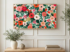 Painted Roses and Berries art on a TV in a living room