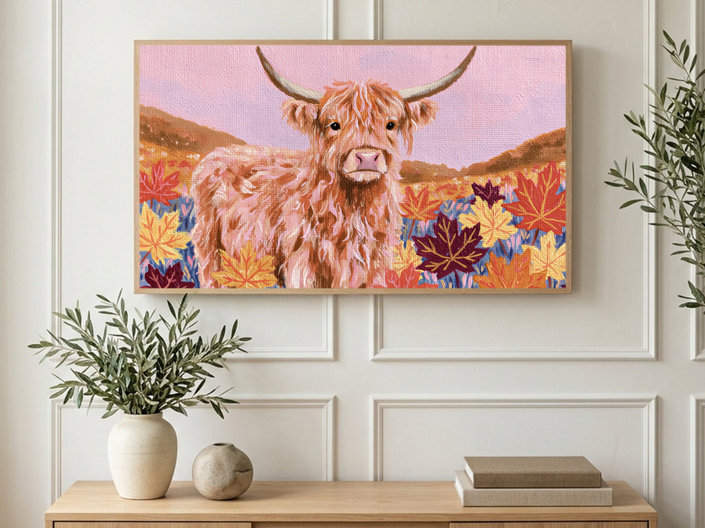 Highland Cow Maple Leaves art on a TV in a living room