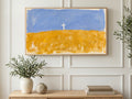 Cross on Golden Field art on a TV in a living room