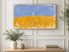 Cross on Golden Field art on a TV in a living room