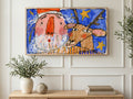 Crayon Santa and Reindeer art on a TV in a living room