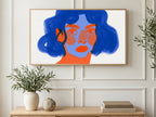 Cobalt Brushstroke Portrait art on a TV in a living room