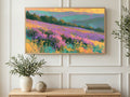 Purple Heather Hills art on a TV in a living room