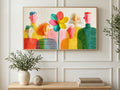 Rainbow Flower Crowd art on a TV in a living room