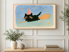 Broomstick Black Kitten art on a TV in a living room