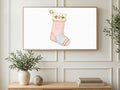 Paw Print Stocking art on a TV in a living room