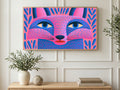 Dotted Folk Fox art on a TV in a living room