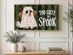 Too Cute to Spook Dog art on a TV in a living room