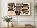 Stacked Polka Dot Teacups art on a TV in a living room