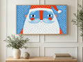 Polka Dot Santa art on a TV in a living room