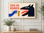 Feed Me Ramen Monster art on a TV in a living room