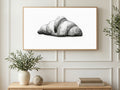Croissant Ink Etching art on a TV in a living room