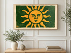 Woodblock Smiling Sun art on a TV in a living room