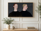 Redhead and Blonde Portrait art on a TV in a living room