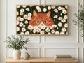 Daisy Field Ginger Cat art on a TV in a living room