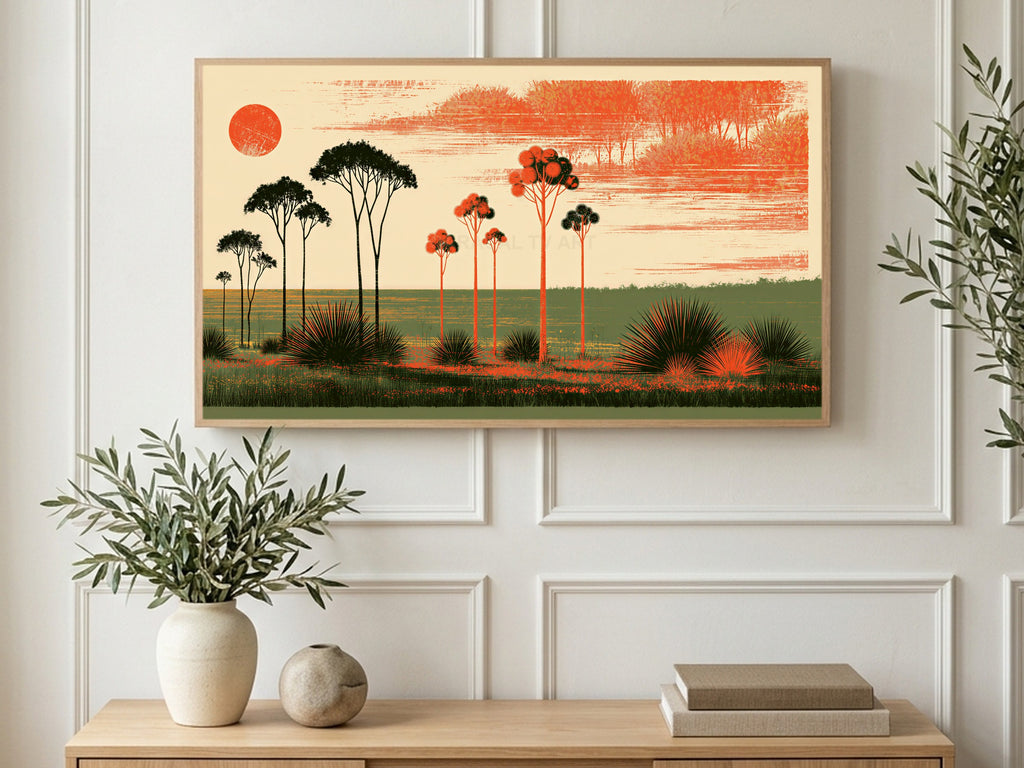 Orange Sun Tree Silhouettes art on a TV in a living room