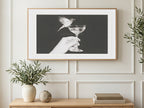 Bird on Champagne Coupe art on a TV in a living room
