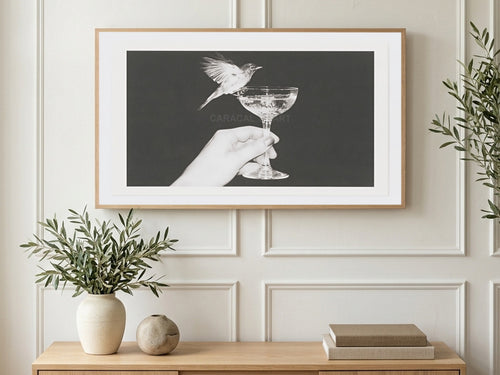 Bird on Champagne Coupe art on a TV in a living room