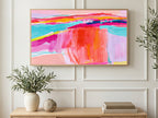 Pink Turquoise Horizon art on a TV in a living room