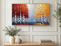 Red and Gold Birches art on a TV in a living room