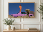 Pink Car Desert Pose art on a TV in a living room
